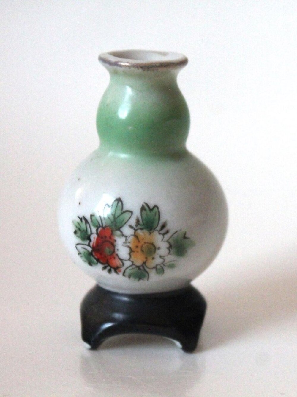 Miniature White and Pale Green Vase with Flowers & Black Base (Japan, 1945–1952)